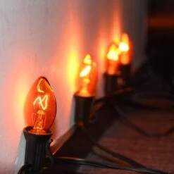 Lumières De Noël Orange SUNSGNE C7, Lumières De Cordes Orange Extérieures 25Ft Avec 27 Ampoules Orange Clair ( 2 Pièces De Rechange ), Lumières De Noël Vintage Pour Patio, Café, Fête, Vacances, Décoration De Noël - Fil Noir 11 Lumières De Noël Orange SUNSGNE C7, Lumières De Cordes Orange Extérieures 25Ft Avec 27 Ampoules Orange Clair ( 2 Pièces De Rechange ), Lumières De Noël Vintage Pour Patio, Café, Fête, Vacances, Décoration De Noël - Fil Noir -Oui || N/A || pearhead 51OYV8a25AL. AC SL1001